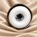A close-up studio shot of a white circular ring-shaped product with a gold-toned rim, placed on draped champagne satin fabric.