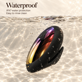A black oval waterproof speaker floating underwater in clear water with sunlight ripples on the surface. Text at the top reads 'Waterproof' with 'IPX7 water protection' and 'Easy to rinse clean'.