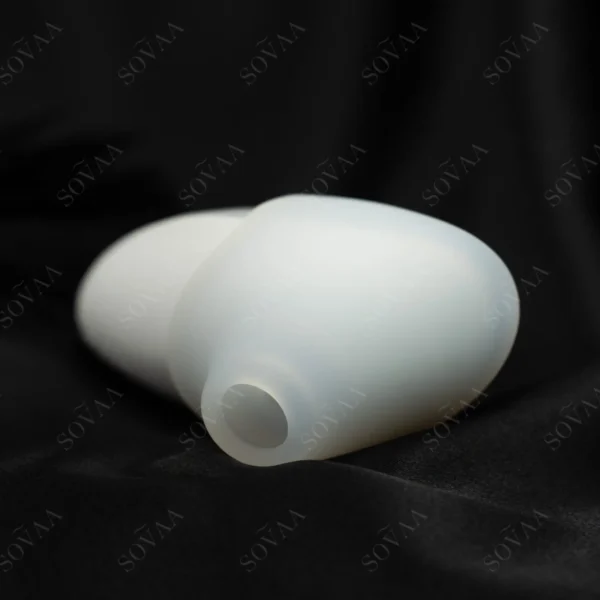 Lyra Pro Pulse Intimate Massager in white silicone on dark satin background